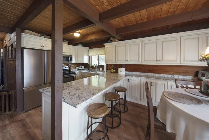 Painted kitchen cabinetry showing framed door and drawer construction
